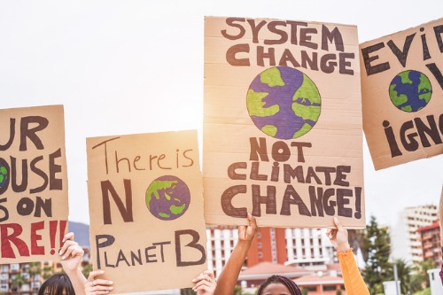 Climate protesters target Lloyd’s with a tipper truck